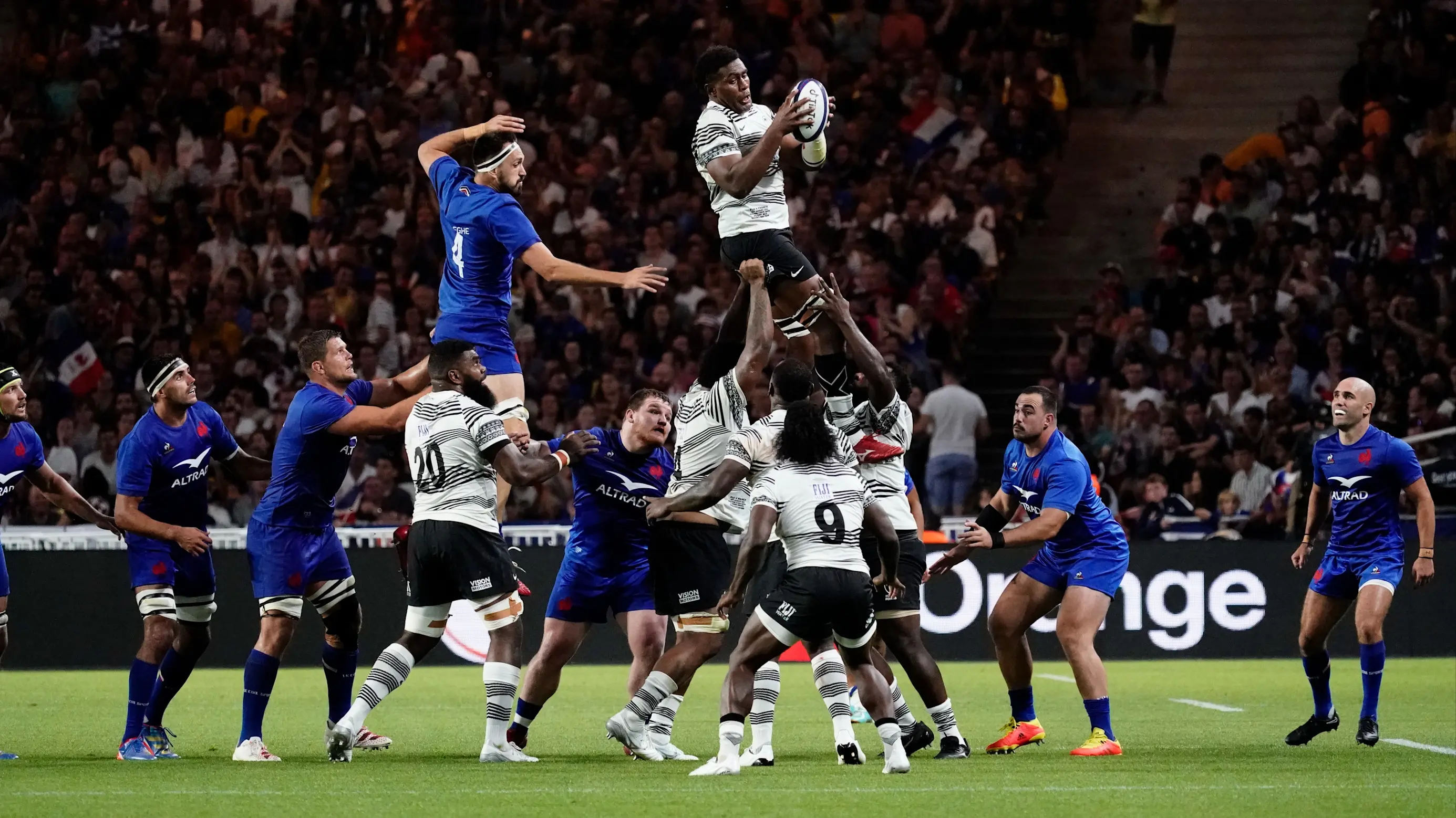 Te Ahiwaru Cirikidaveta of Fiji takes the line-out ball ahead of Florian Verhaeghe of France in 2023.