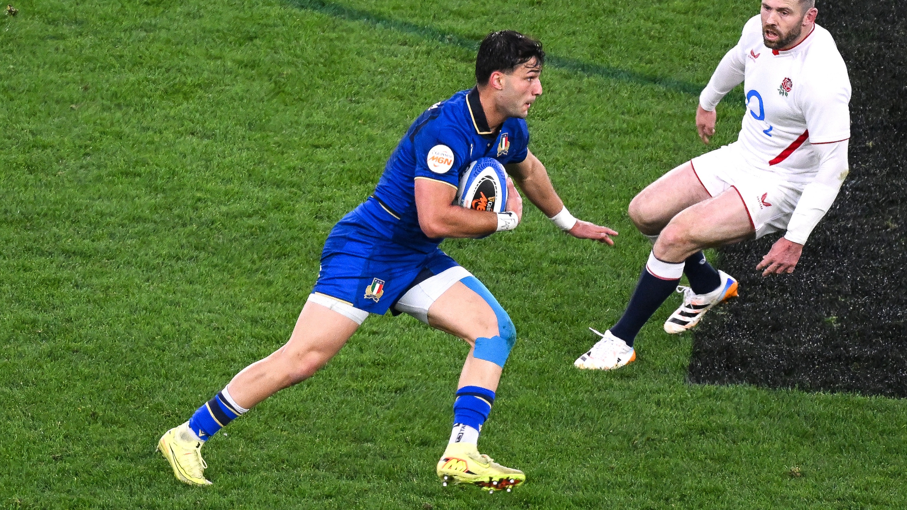 Lorenzo Pani looks to evade the oncoming Elliot Daly during Italy's round four match against England in the 2026 Championship.