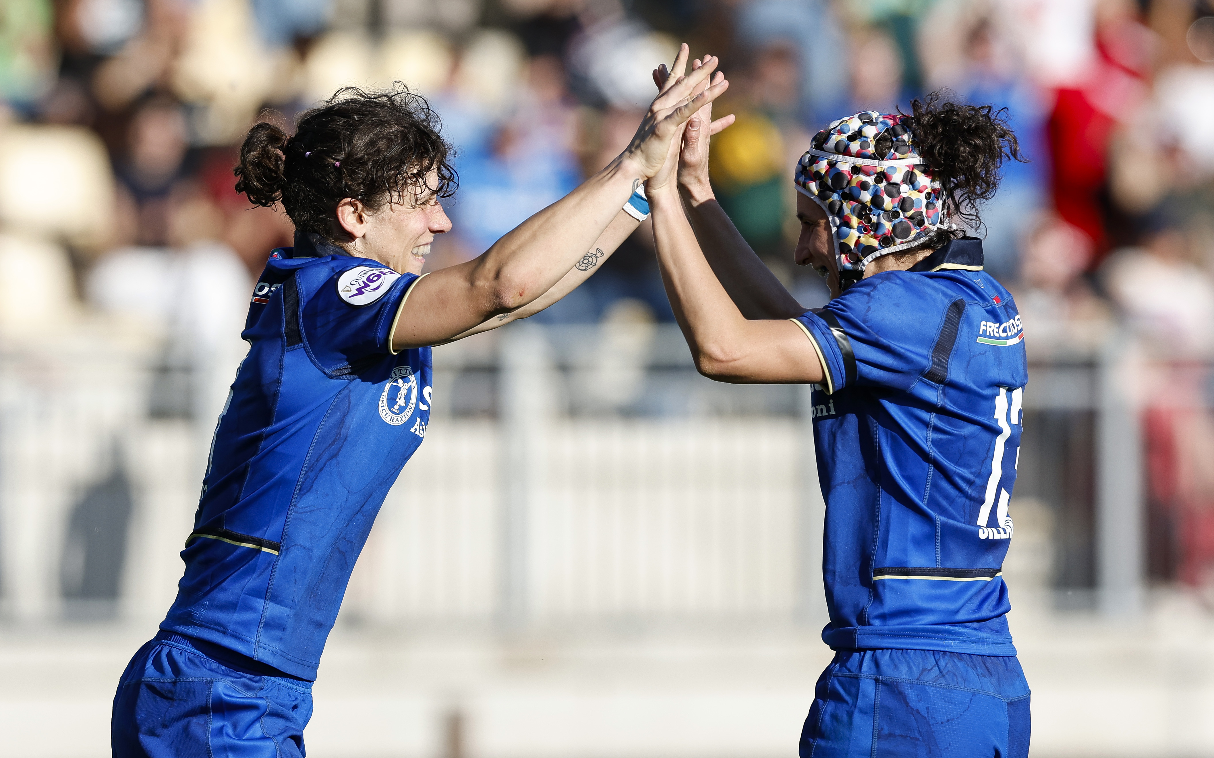 Italy's Aura Muzzo celebrates with teammate Michela Sillari after scoring her side's fifth try of the match during the 2026 Guinness Women's Six Nations match against Scotland in Stadio Sergio Lanfranchi, Parma