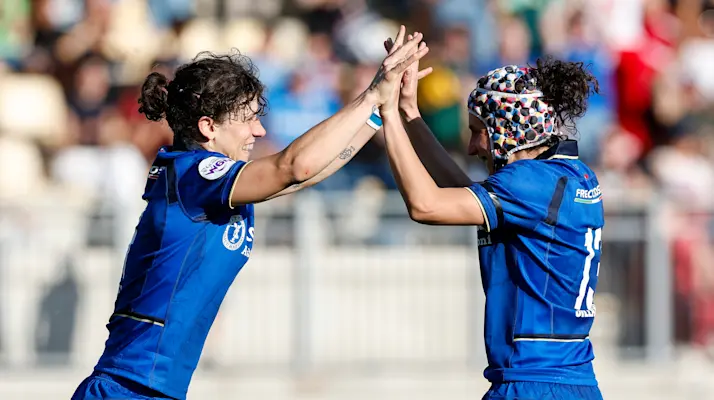 Italy's Aura Muzzo celebrates with teammate Michela Sillari after scoring her side's fifth try of the match during the 2026 Guinness Women's Six Nations match against Scotland in Stadio Sergio Lanfranchi, Parma