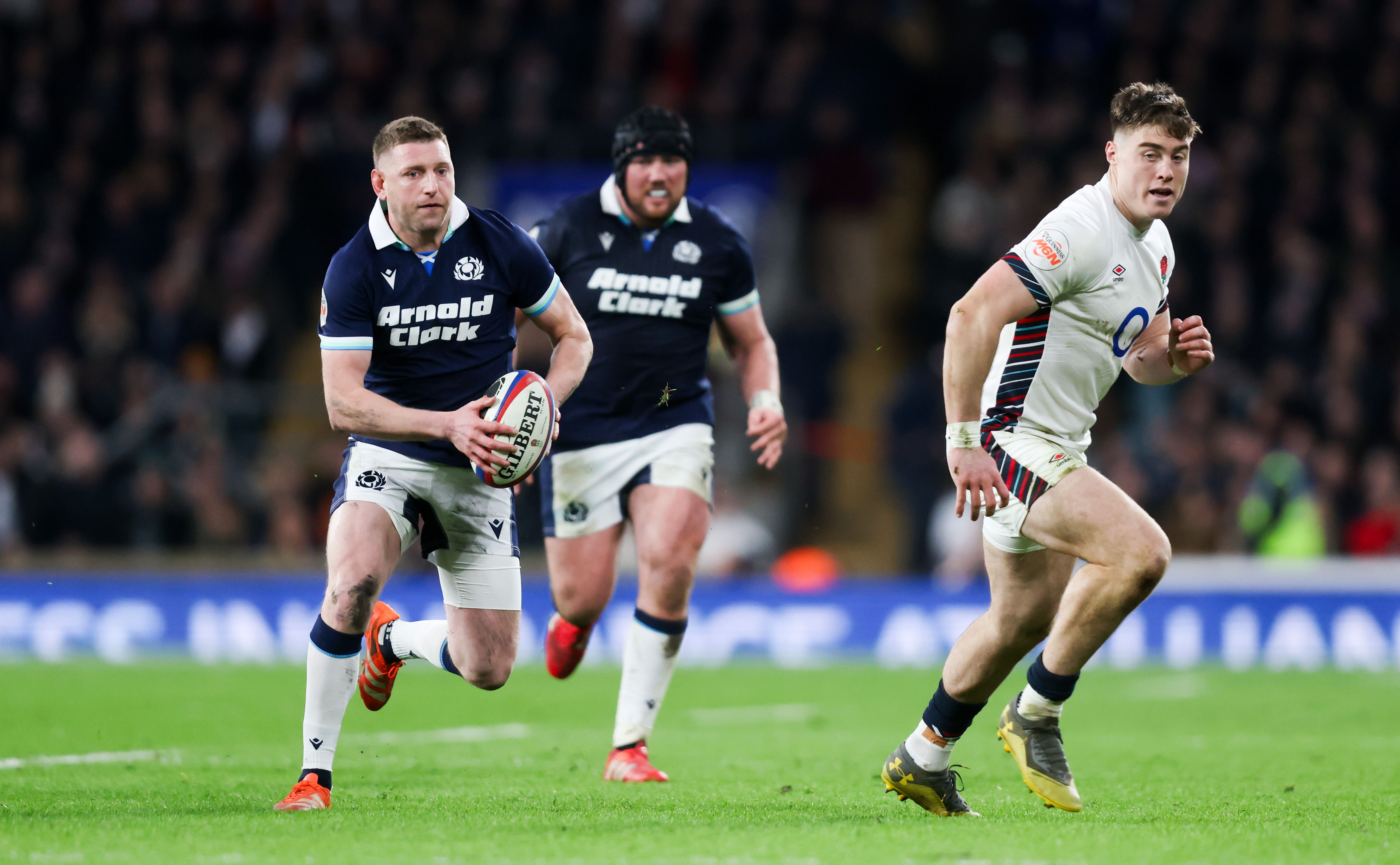 Finn Russell of Scotland and Tommy Freeman of England during the 2025 Calcutta Cup clash.