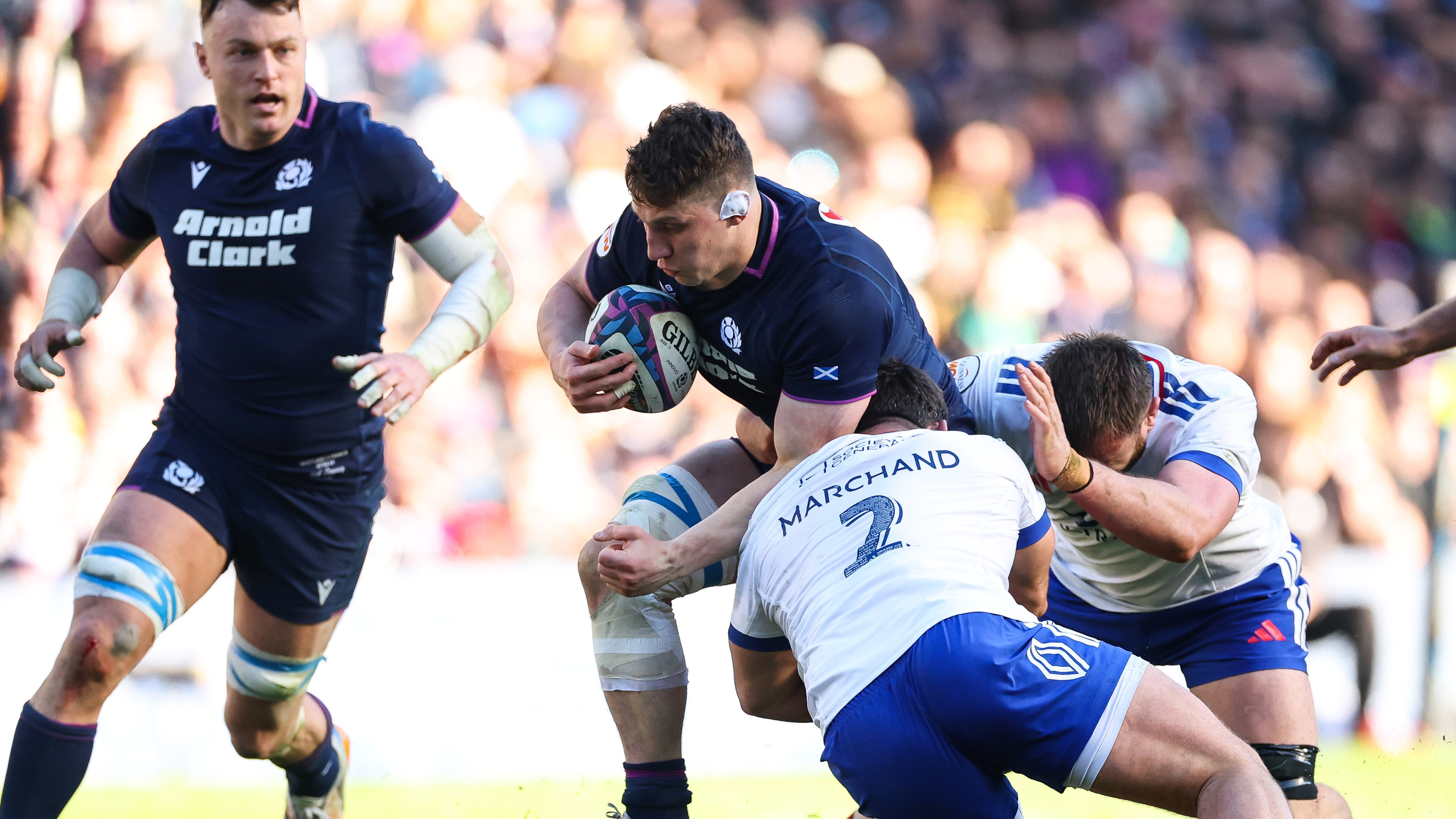 Scotland's Rory Darge is tackled by France’s Julien Marchand during the 2026 Guinness Men's Six Nations match in Edinburgh.