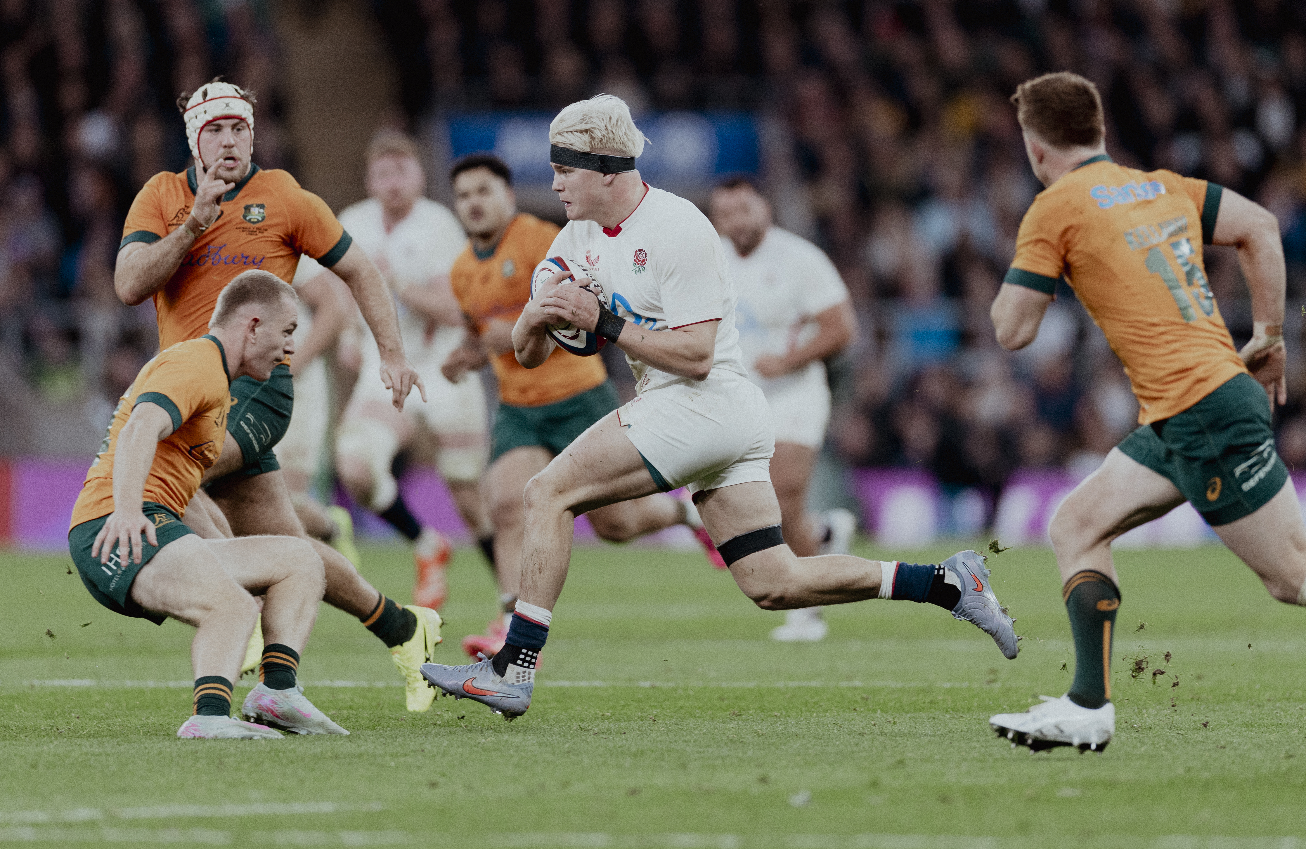 Henry Pollock runs at at Wallabies player during the 2025 Quilter Nations Series.