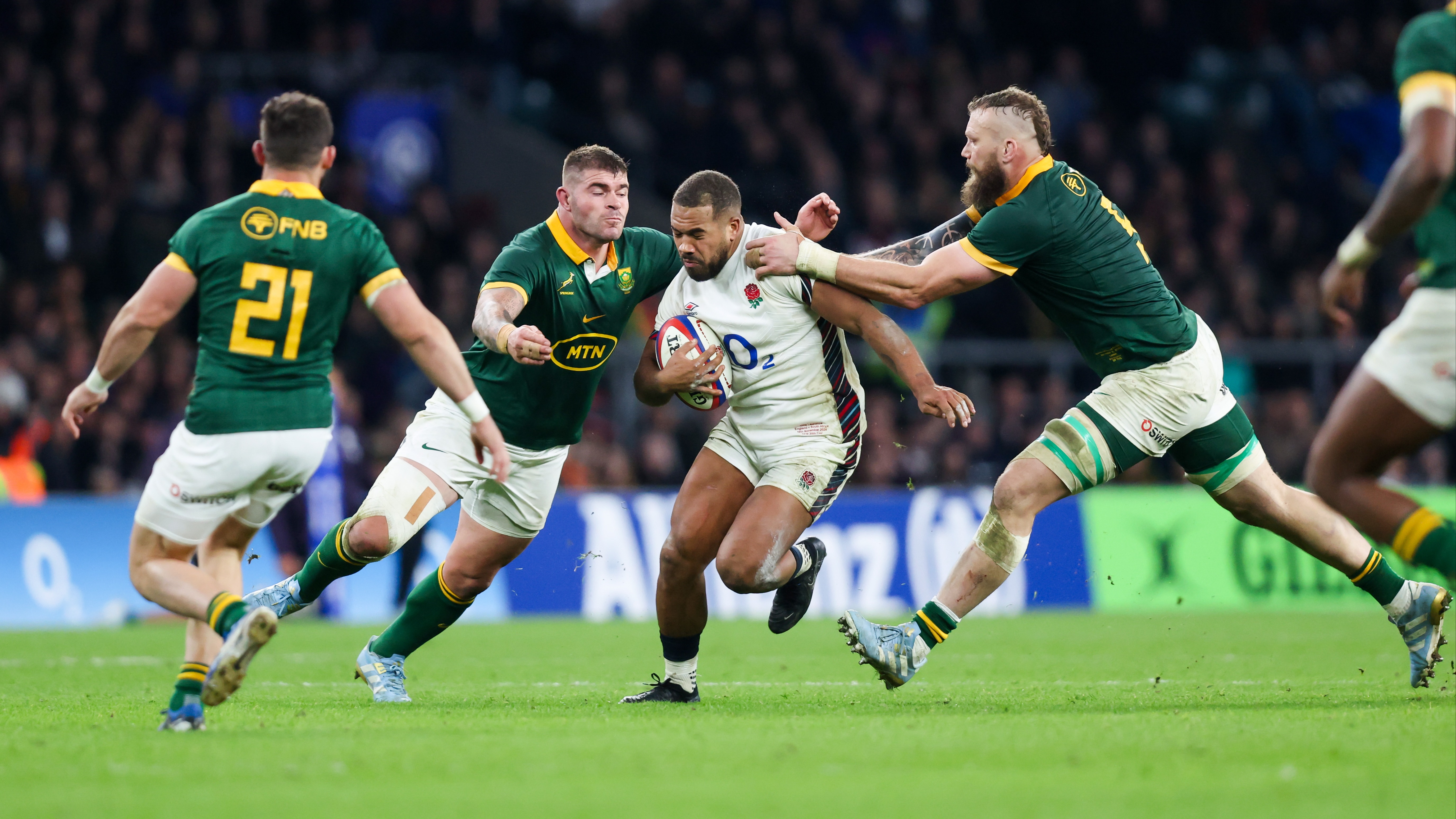South Africa's Malcolm Marx and RG Snyman try to stop England's Ollie Lawrence during the 2024 Autumn Nations Series.