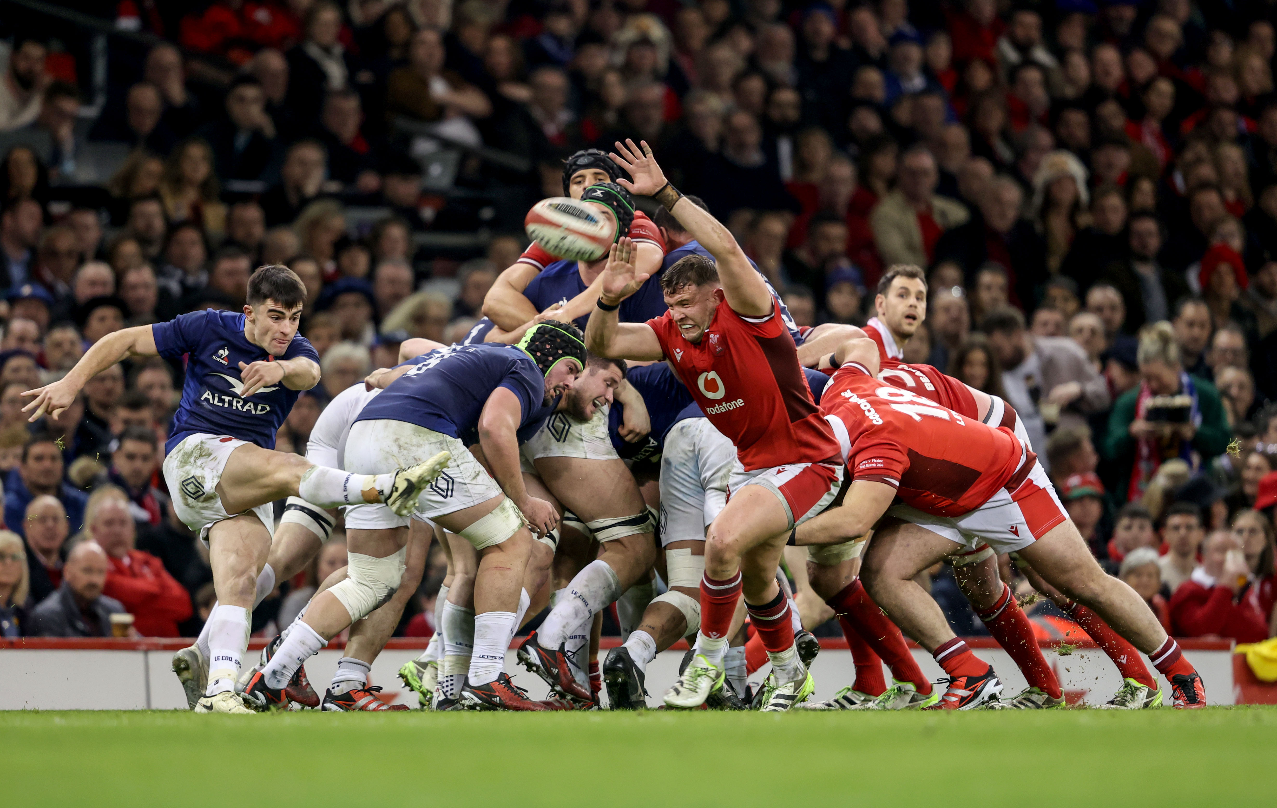 France's Nolann Le Garrec kicks from the back of the scrum during the 2024 Championship match in Cardiff.