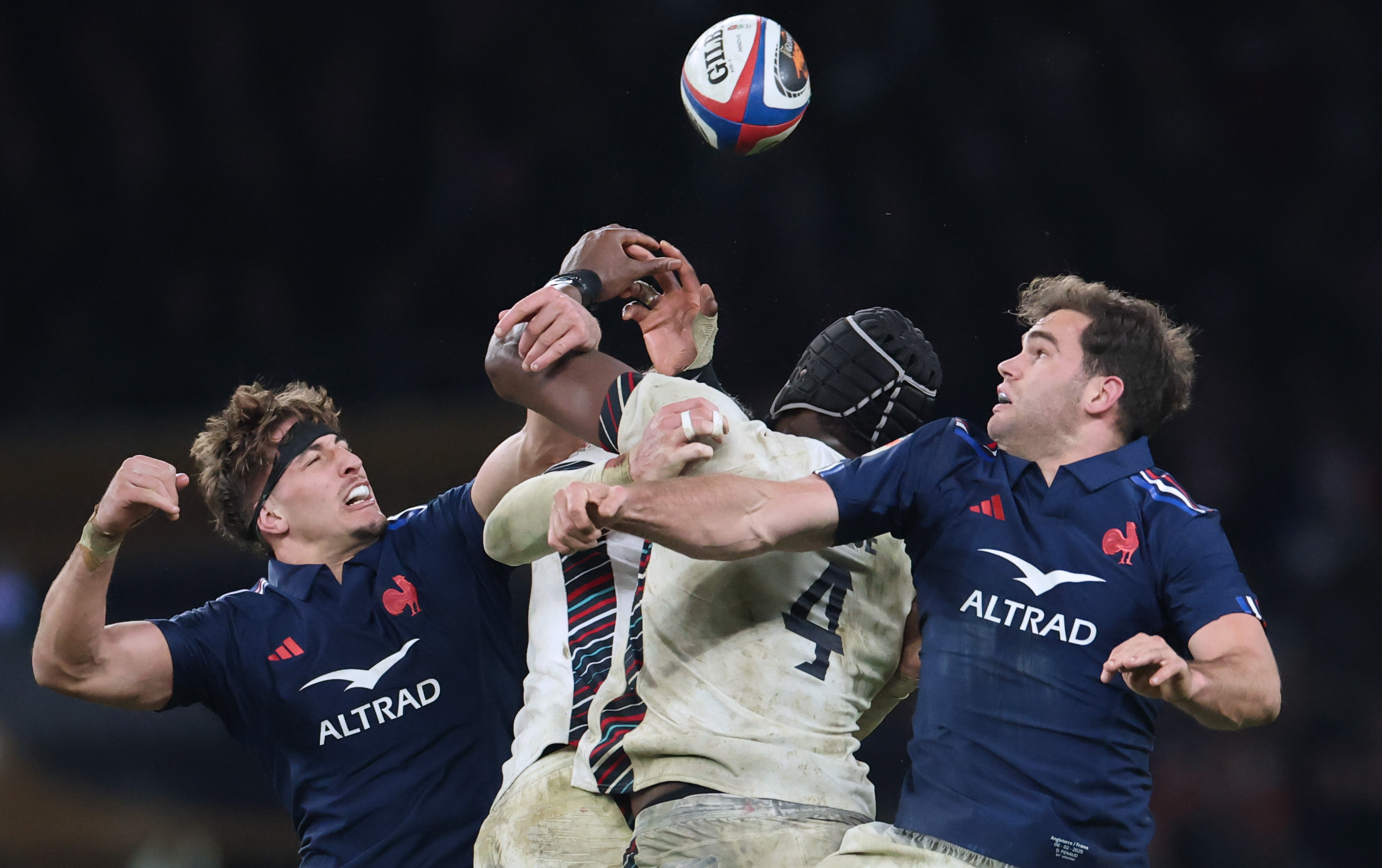 France's Oscar Jegou and Damian Penaud vie for the ball with England's Maro Itoje of England during the 2025 Guinness Six Nations. 