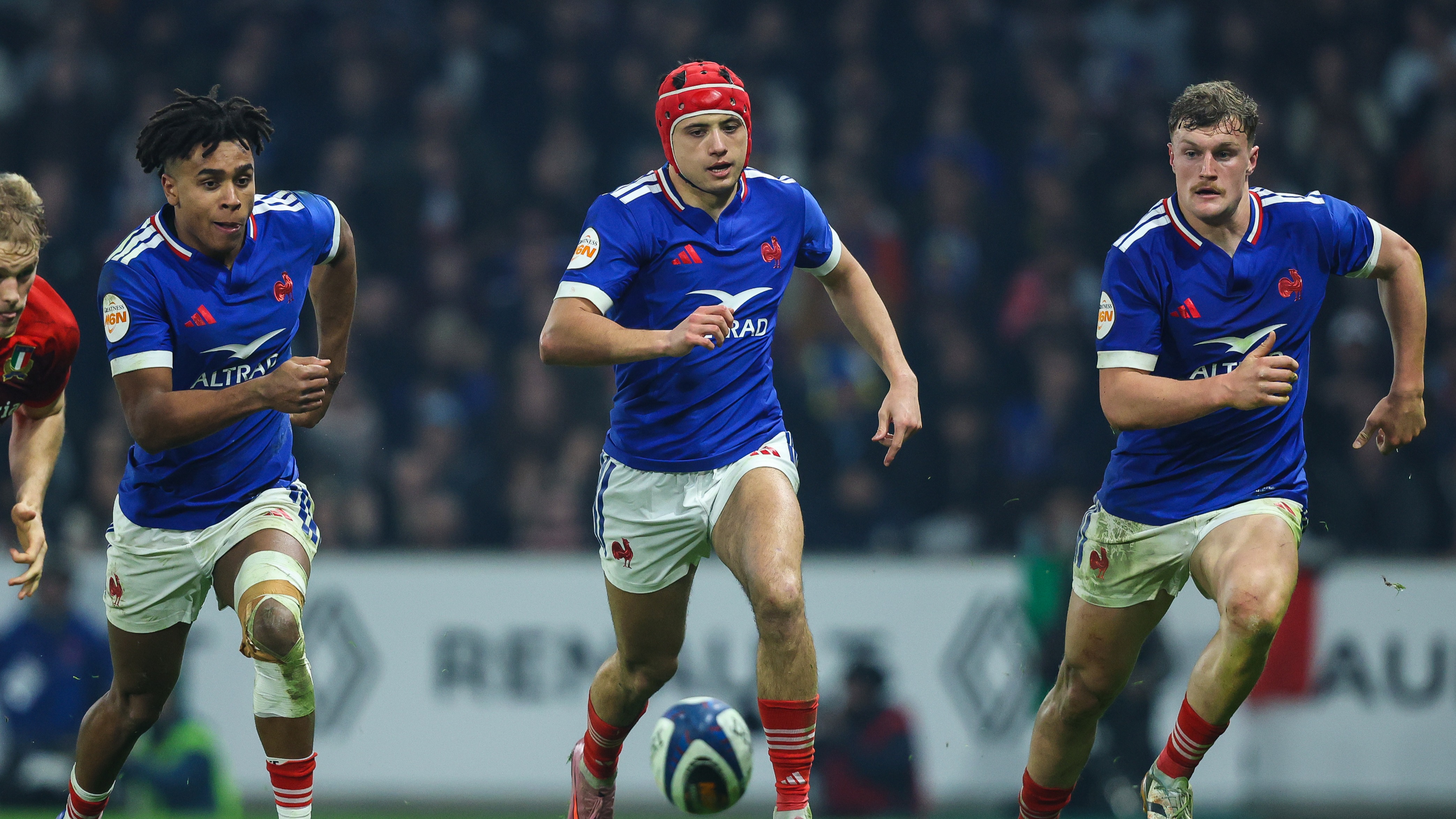  France's Theo Attissogbe, Louis Bielle-Biarrey and Emilien Gailleton chase a loose ball during the 2026 Championship match against Italy.