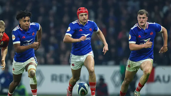 France's Theo Attissogbe, Louis Bielle-Biarrey and Emilien Gailleton chase a loose ball during the 2026 Championship match against Italy.