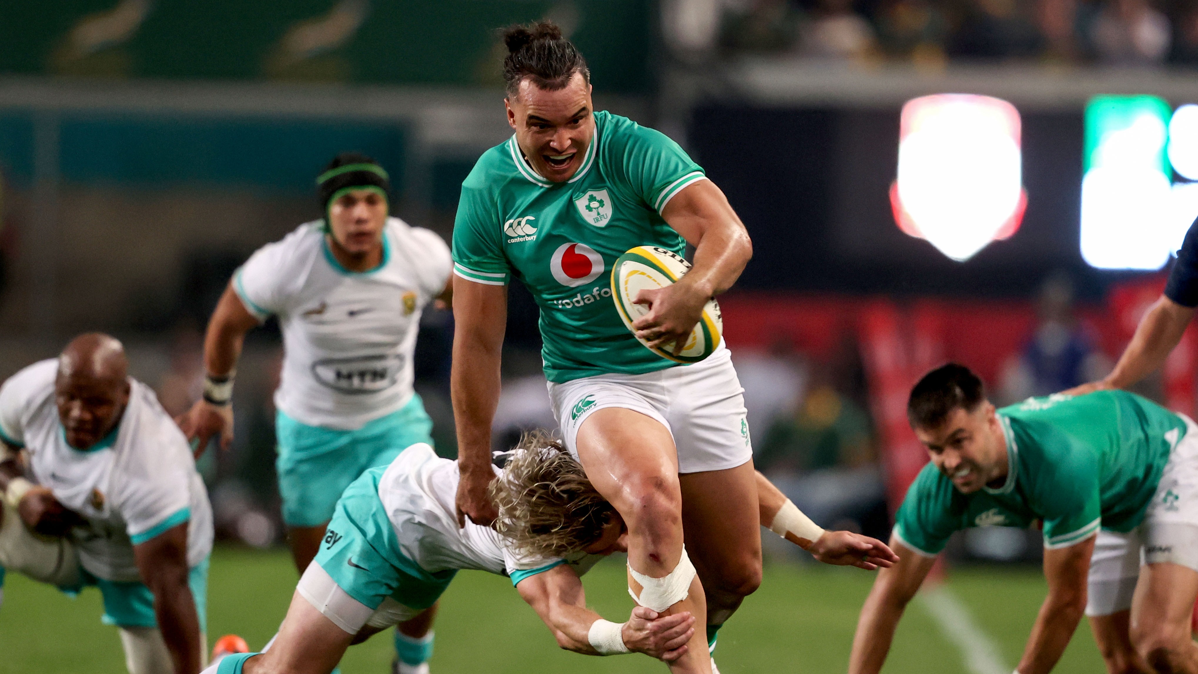 James Lowe slips a tackle by Faf de Klerk during the 2024 Summer Test between Ireland and the Springboks.