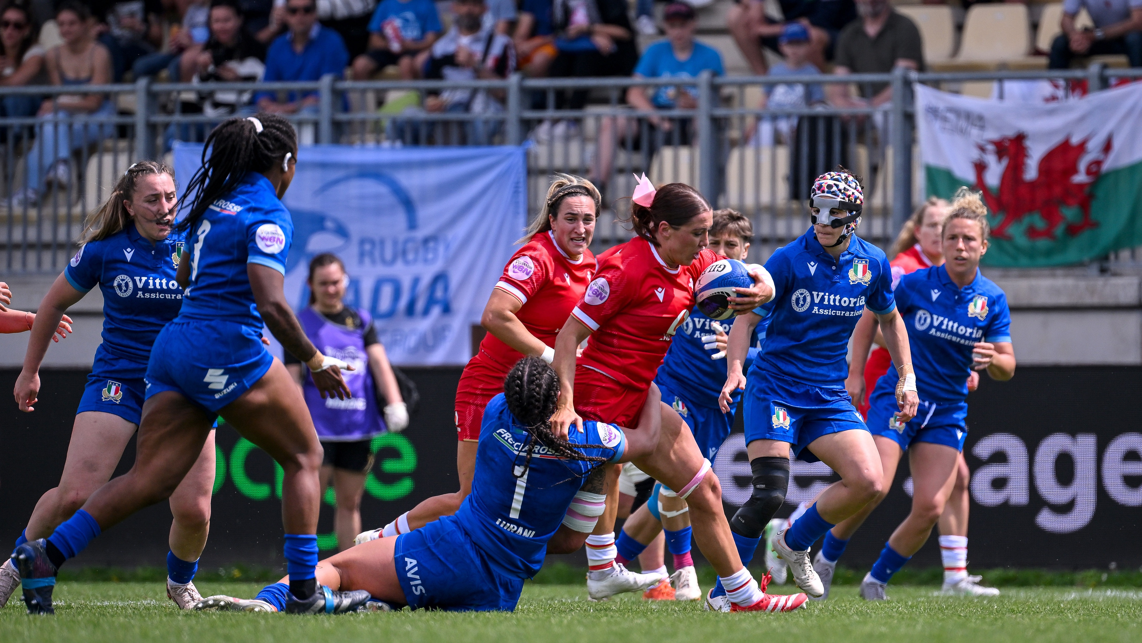 Wales' Georgia Evans carries the ball into the Italian defence during the 2025 Guinness Women's Six Nations Championship Round 5 match in Stadio Sergio Lanfranchi, Parma.