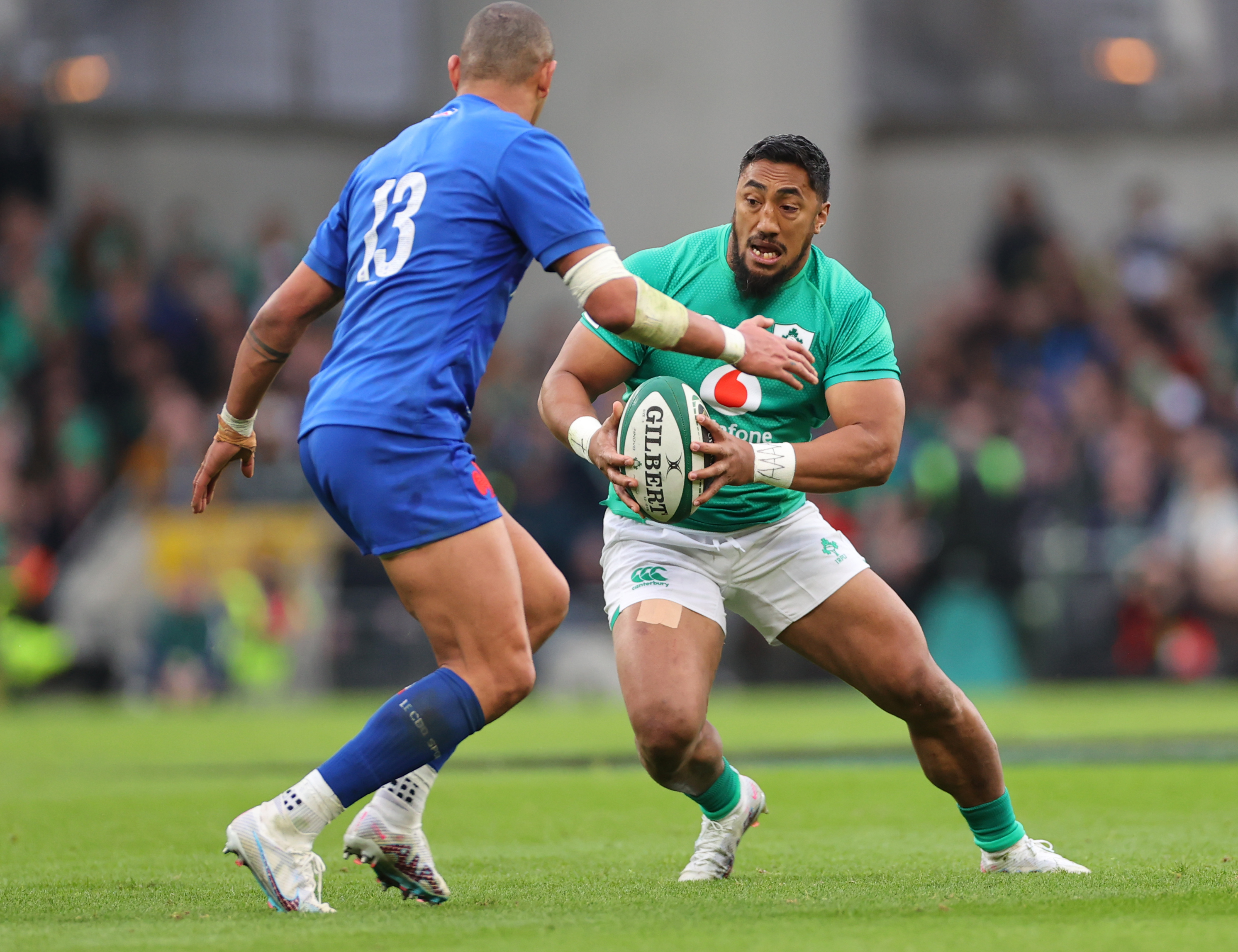 Bundee Aki runs at Gael Fickou