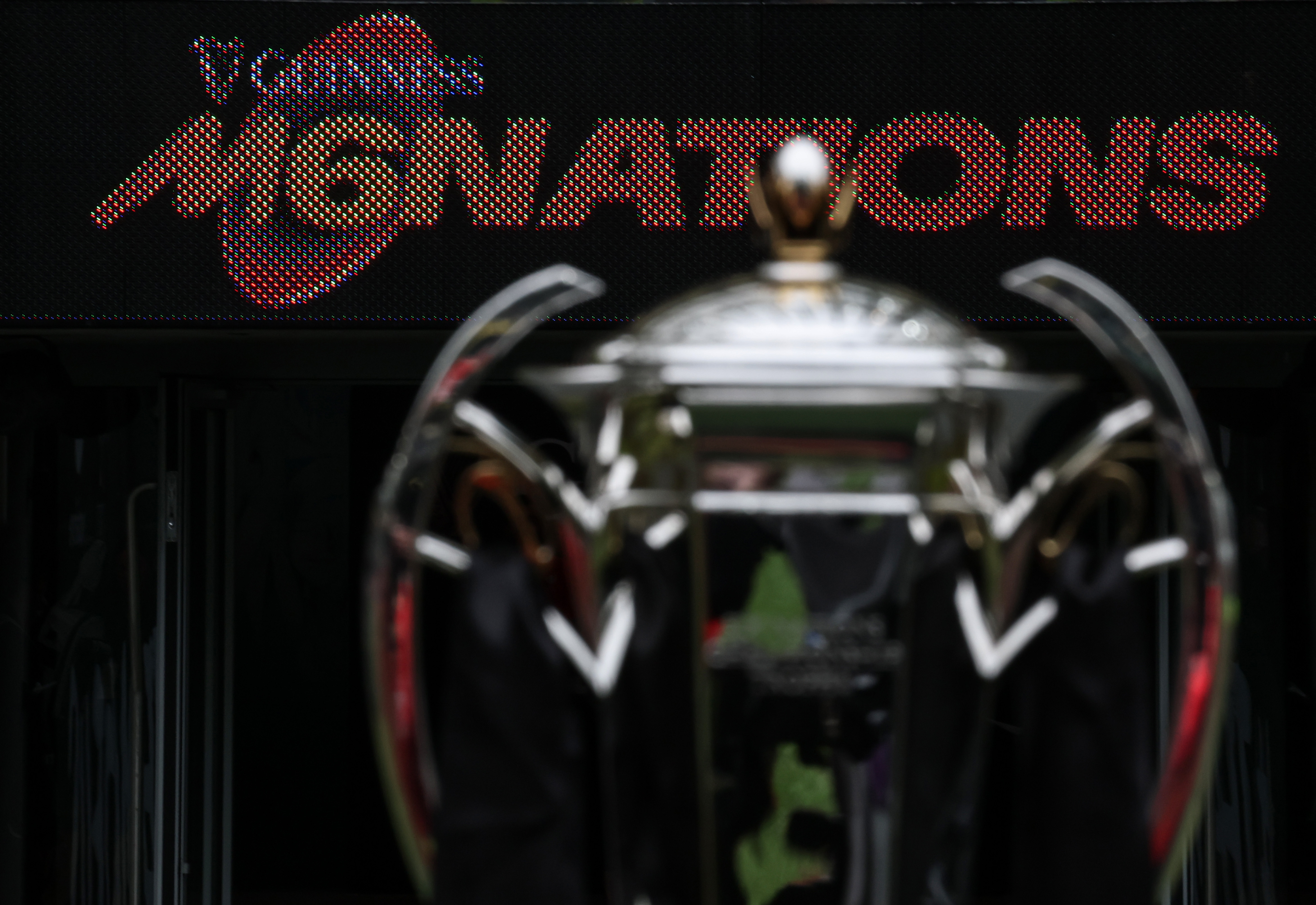 A view of the Men's Six Nations trophy in front of an LED board displaying the Guinness Men's Six Nations logo.
