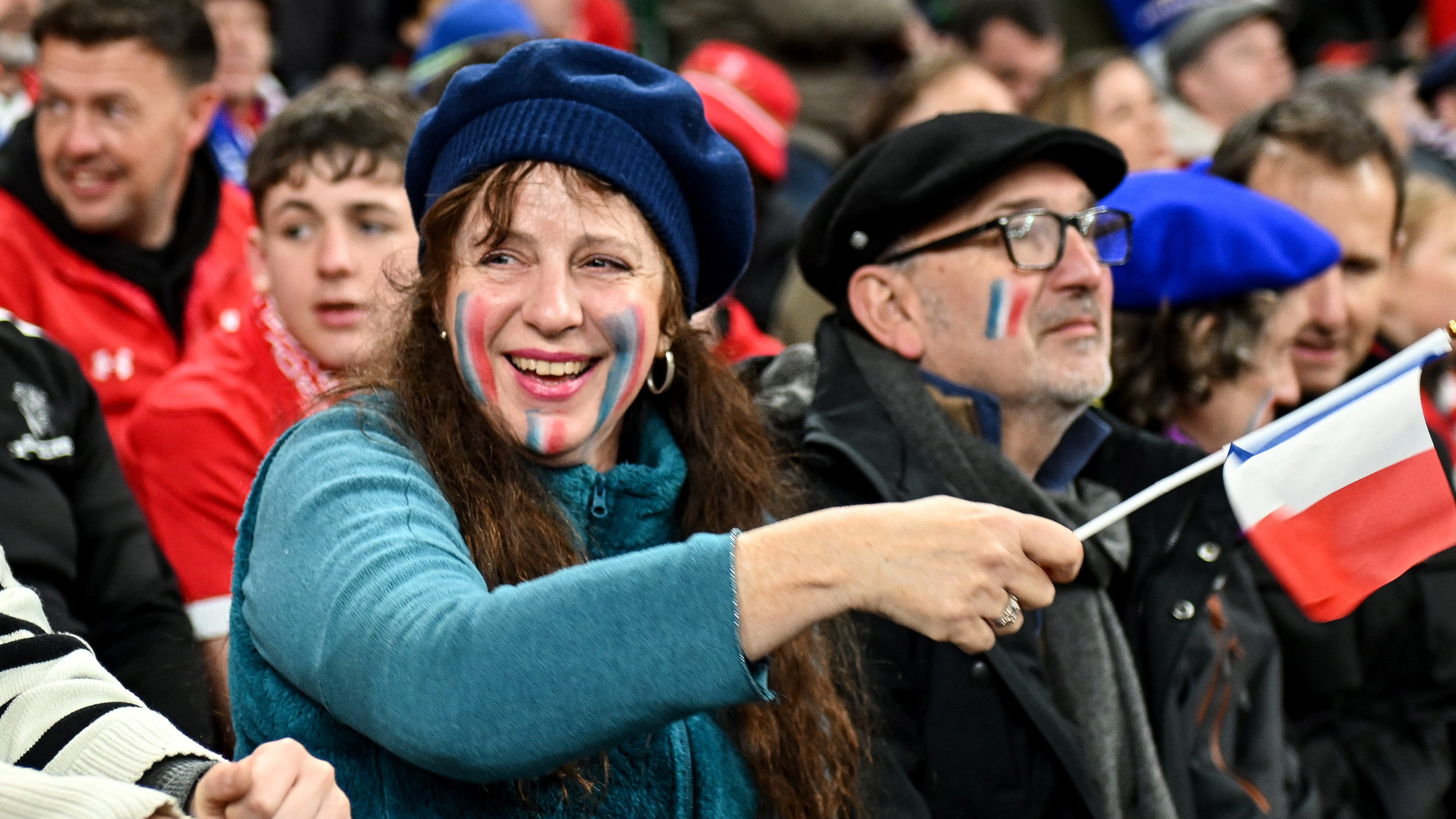 France fans celebrate after their first try of the 2026 Championship match against Wales in Cardiff.