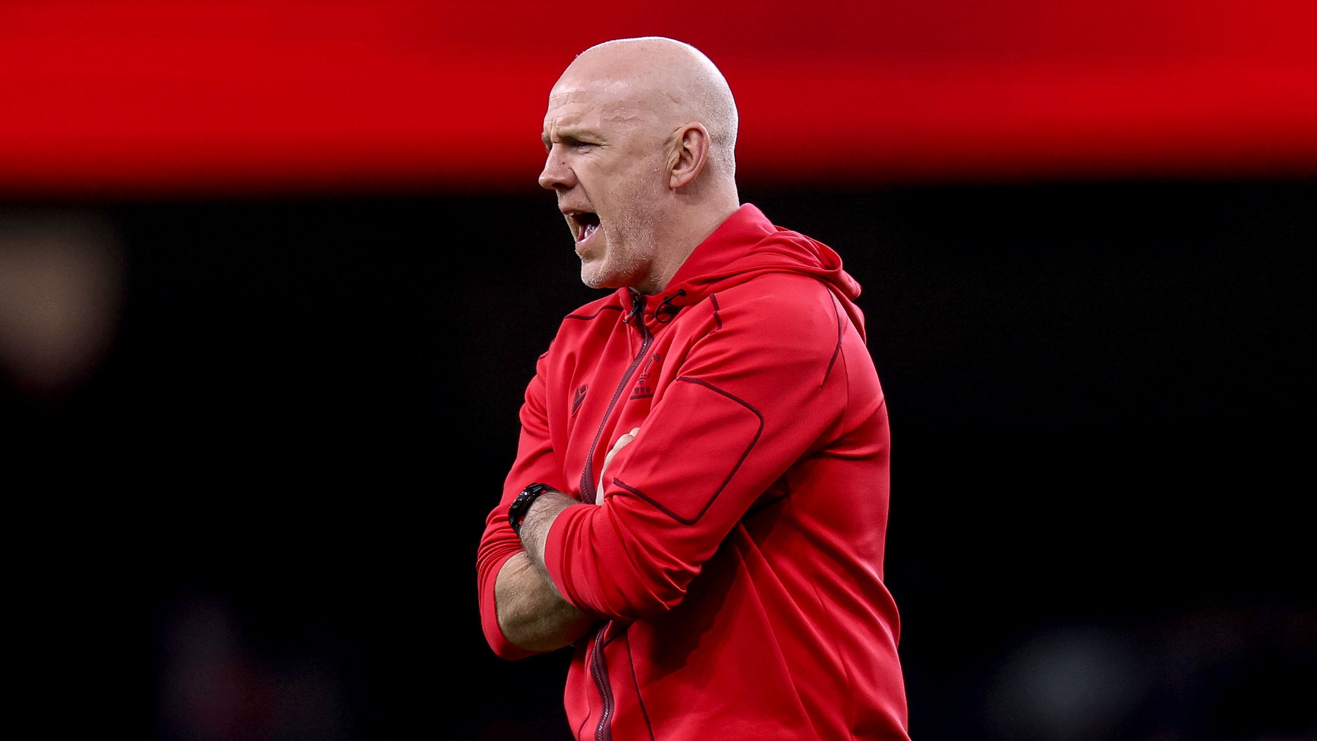 Wales head coach Steve Tandy shouts orders at his team during a warm-up at the Principality Stadium in the 2026 Championship.
