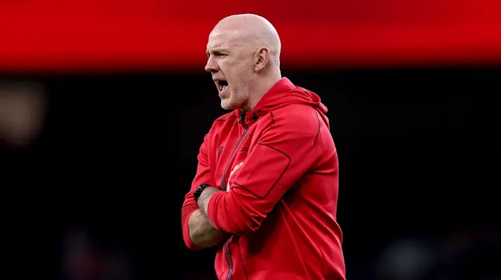Wales head coach Steve Tandy shouts orders at his team during a warm-up at the Principality Stadium in the 2026 Championship.