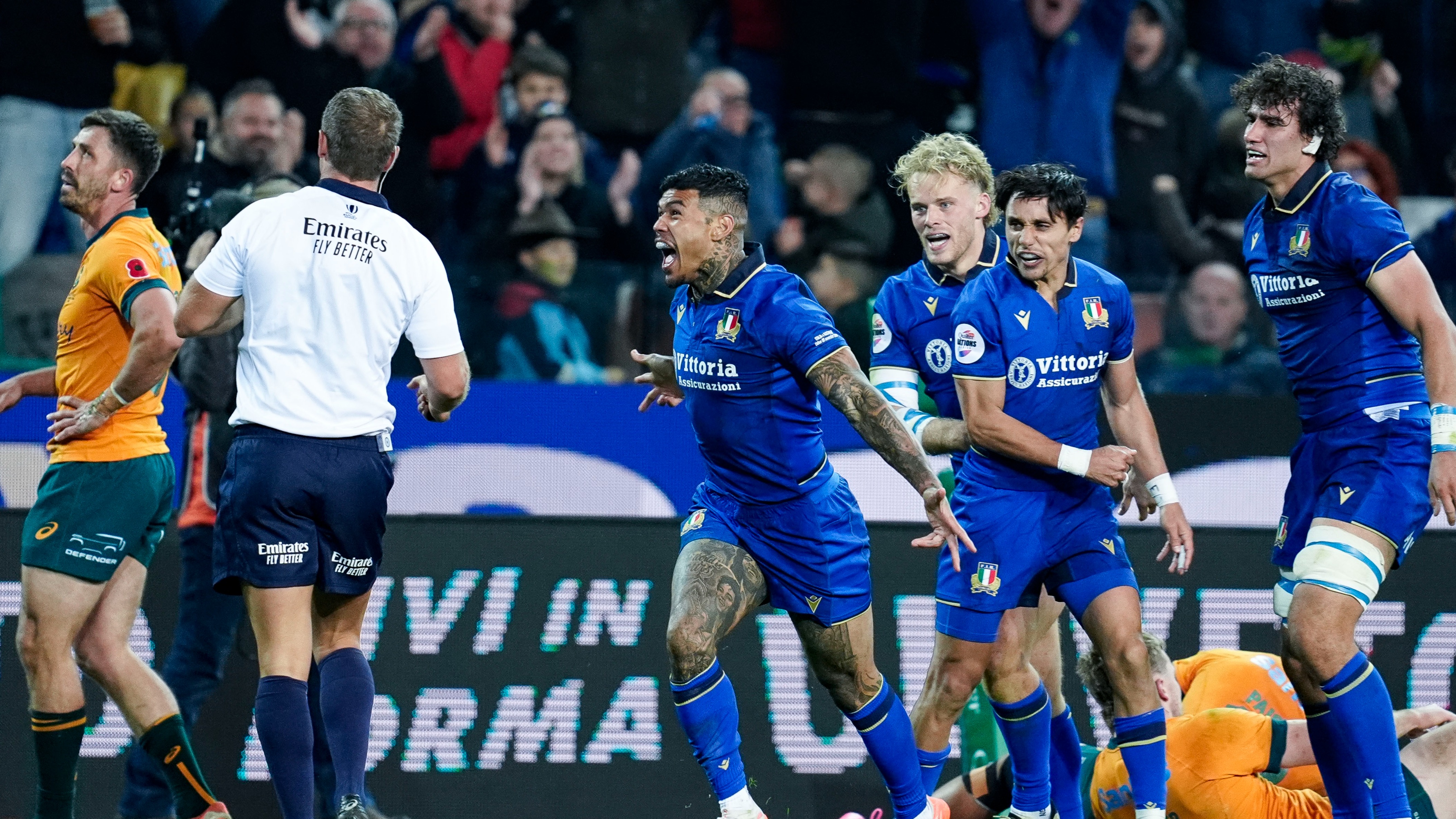 Monty Ioane celebrates with Italy teammates after scoring a try against his native Australia in the Quilter Nations Series.