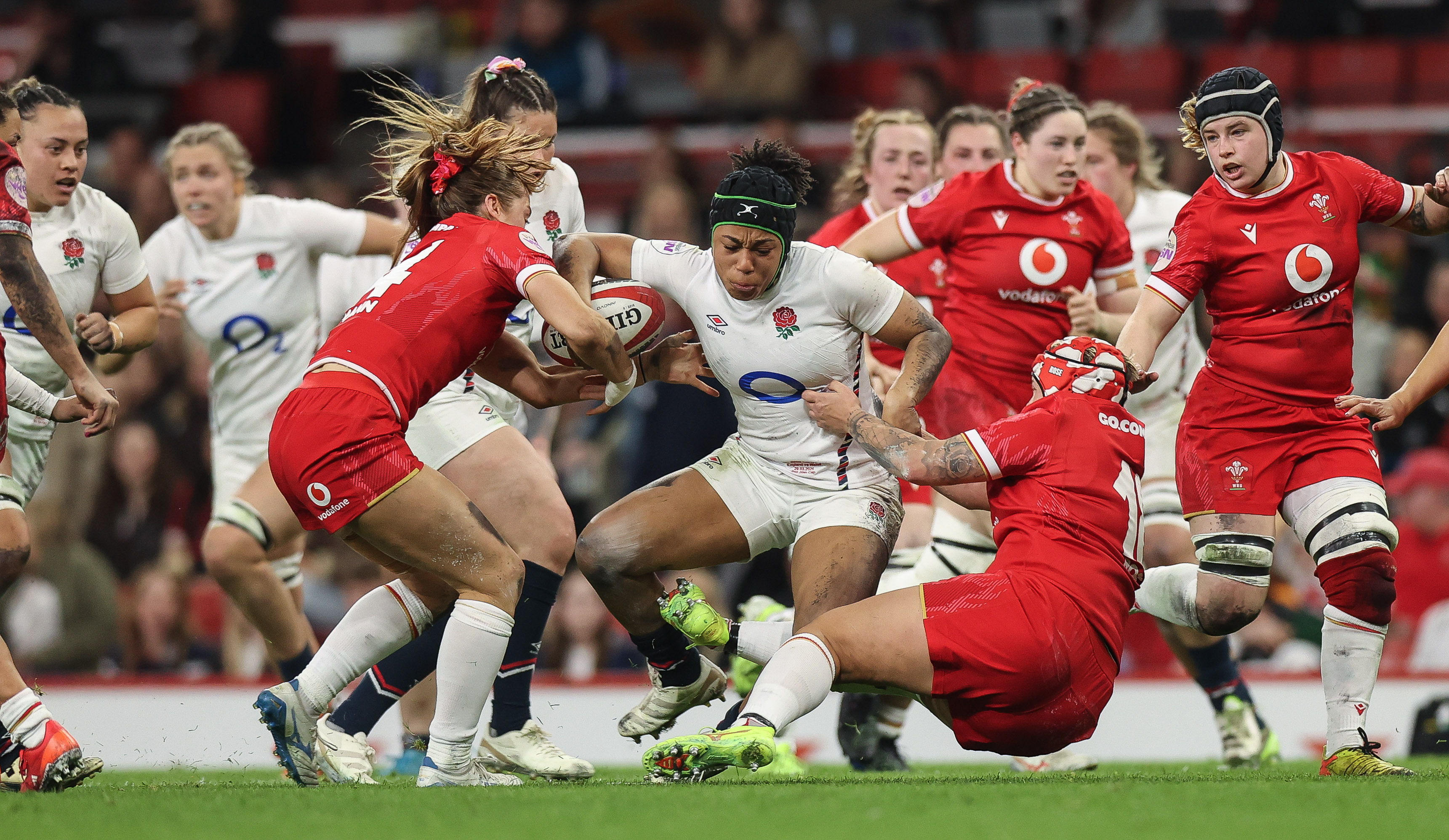England's Sadia Kabeya is tackled by Wales' Lisa Neumann and Donna Rose during the 2025 Guinness Women's Six Nations Championship Round 2 game between Wales and England in the Principality Stadium, Cardiff