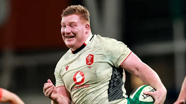 Rhys Carre smiles as he charges in for a famous prop's try against Ireland in round four of the 2026 Championship.