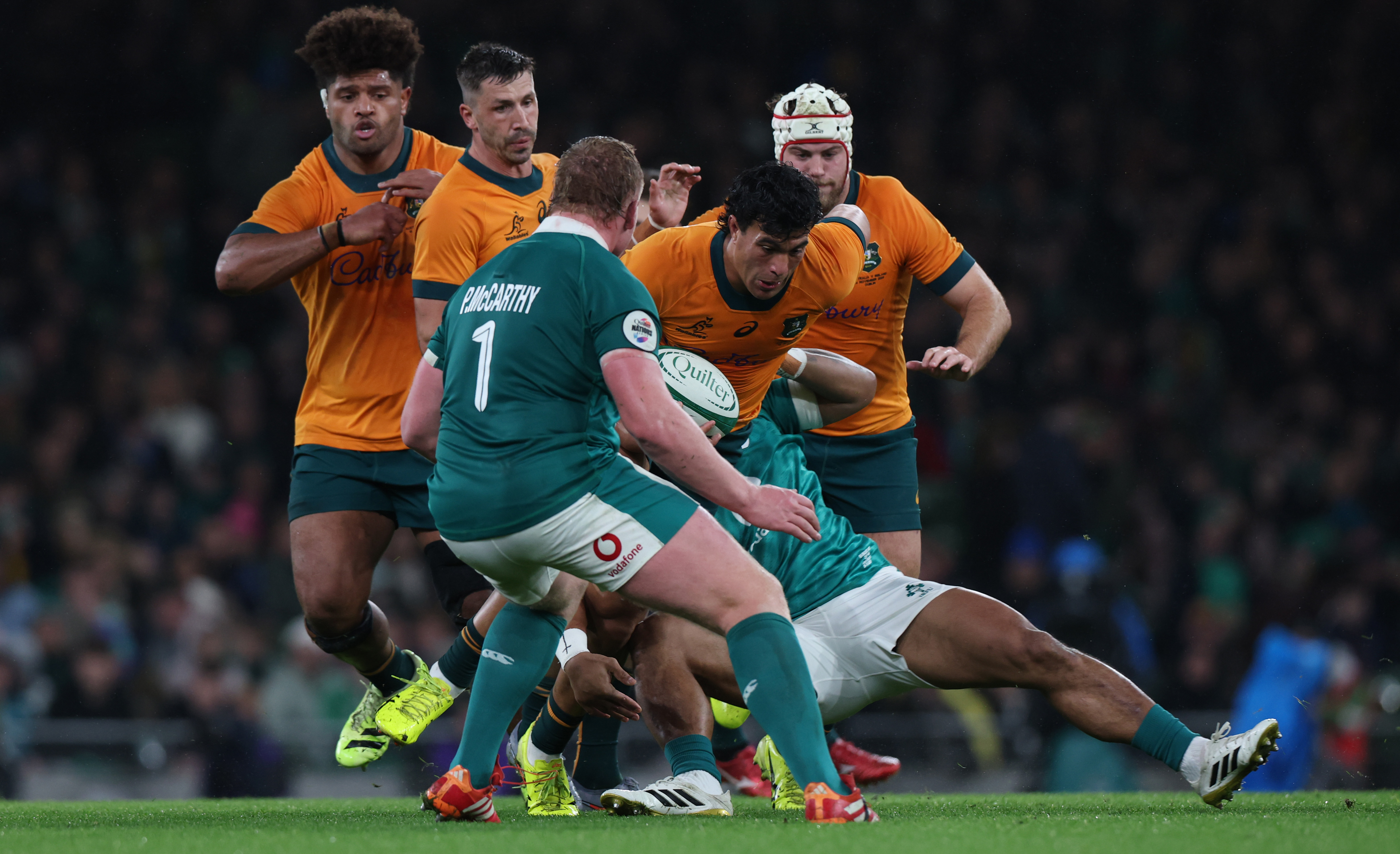 Australia's Joseph-Aukuso Sua'ali'i is tackled during the 2025 Quilter Nations Series game between Ireland and Australia in Aviva Stadium, Dublin.