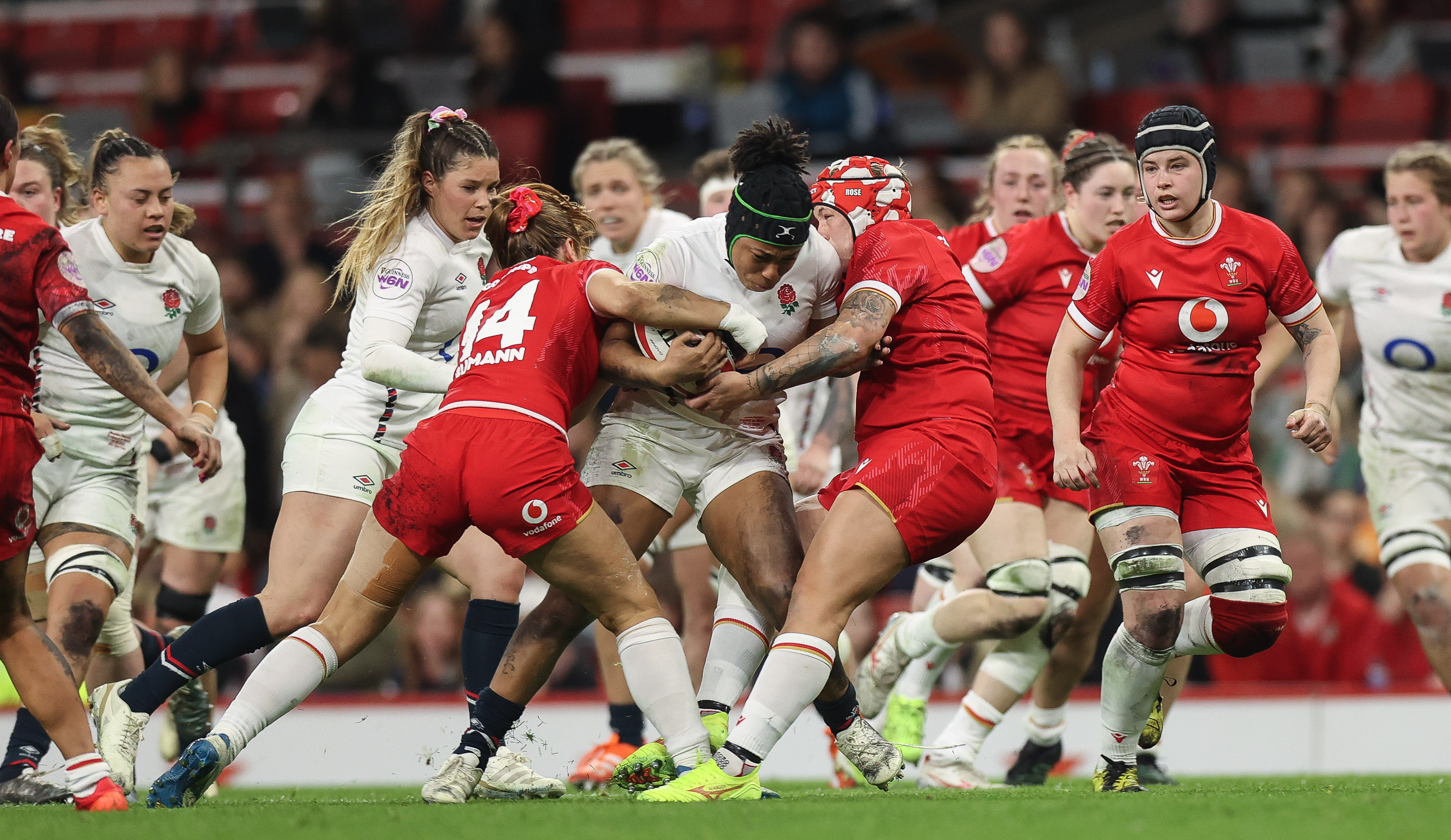England's Sadia Kabeya is tackled by Wales' Lisa Neumann and Donna Rose during the 2025 Guinness Women's Six Nations.