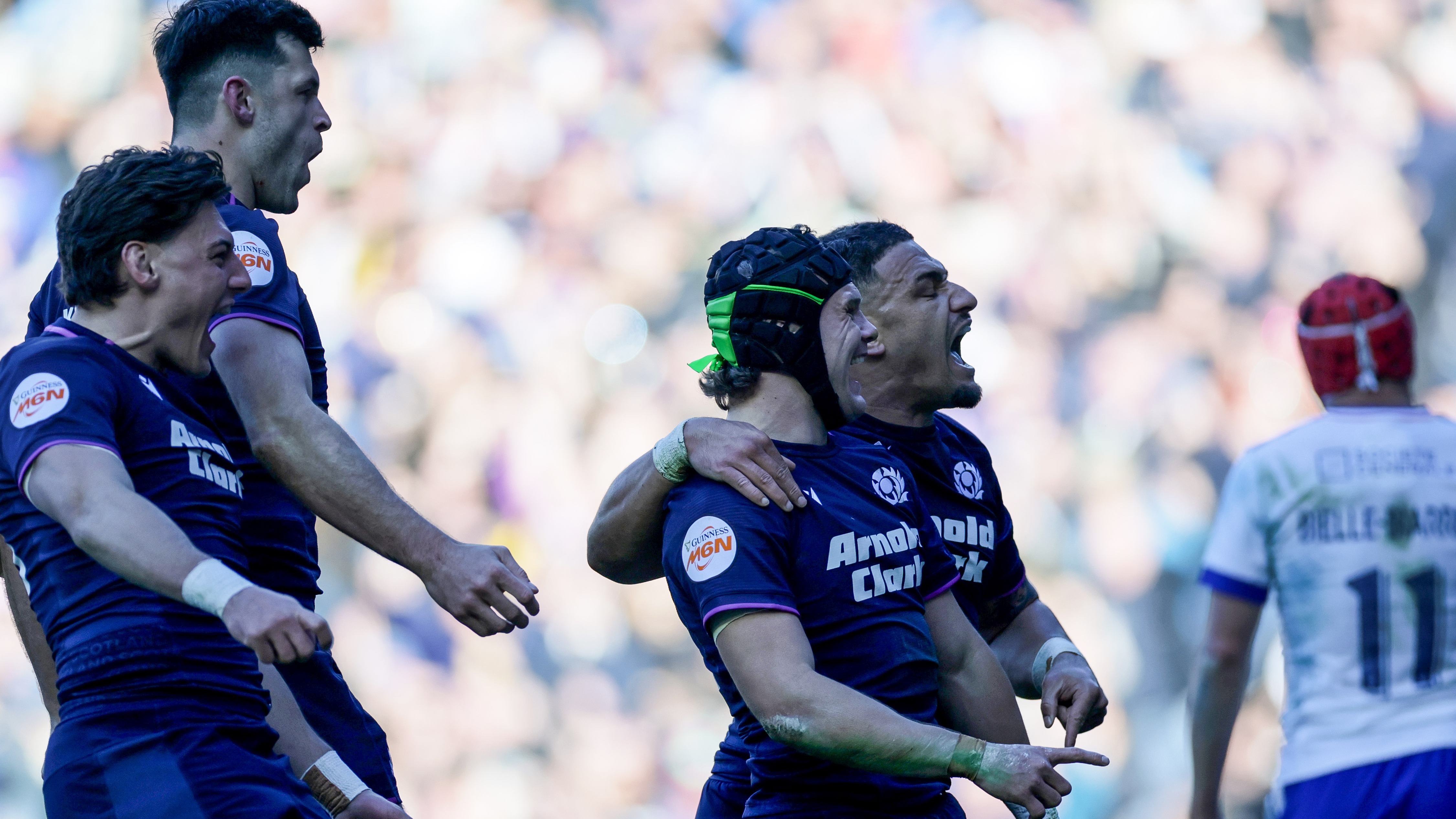 Darcy Graham celebrates scoring a try with teammates in the Scotland v France match in Edinburgh, 2026.