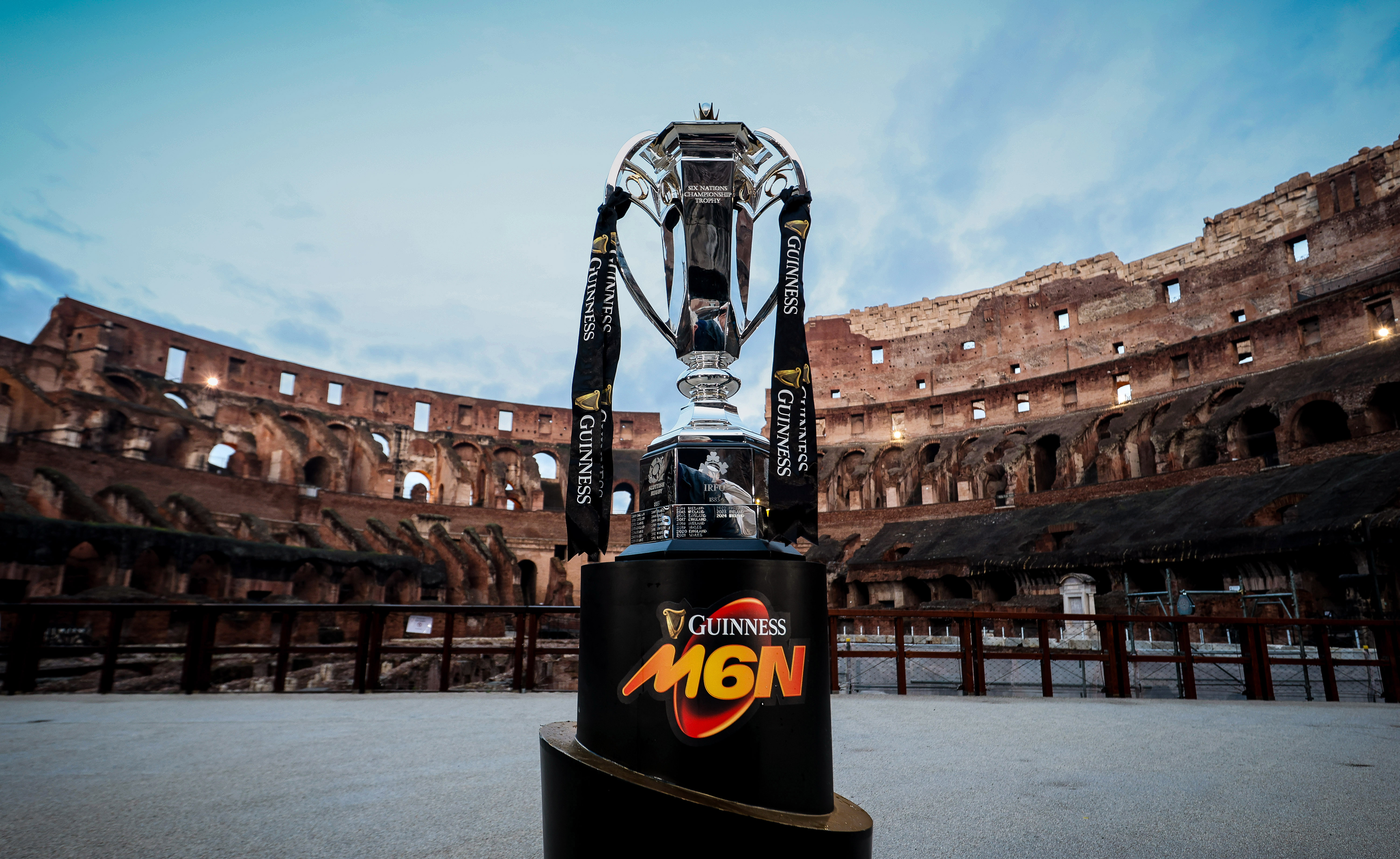 A view of the Guinness Men's Six Nations trophy against a backdrop of the Colosseum.