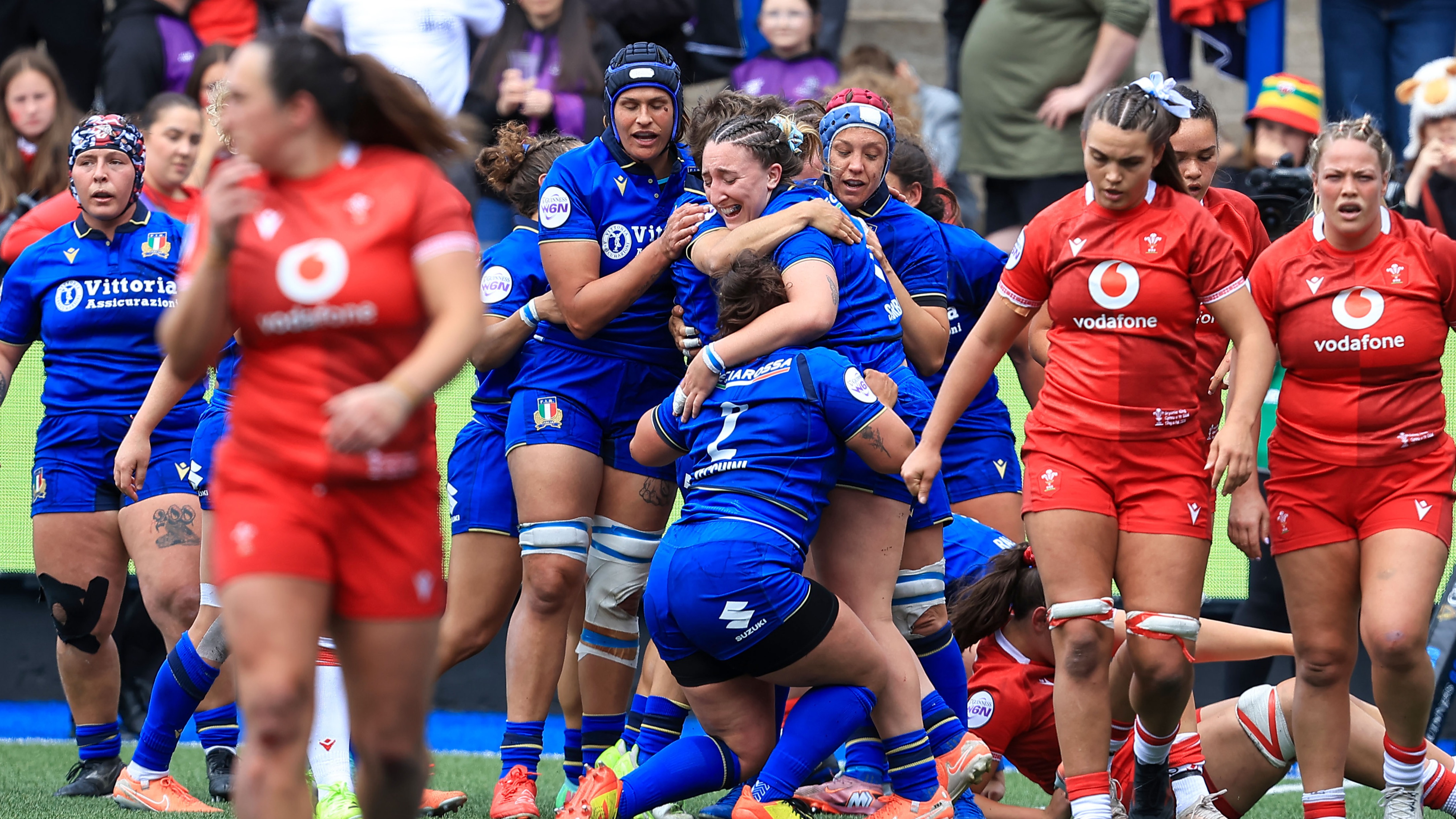 Italy's Francesca Sgorbini celebrates scoring a try with teammates during the 2026 Guinness Women's Six Nations Championship Round 5 game between Wales and Italy in Cardiff Arms Park