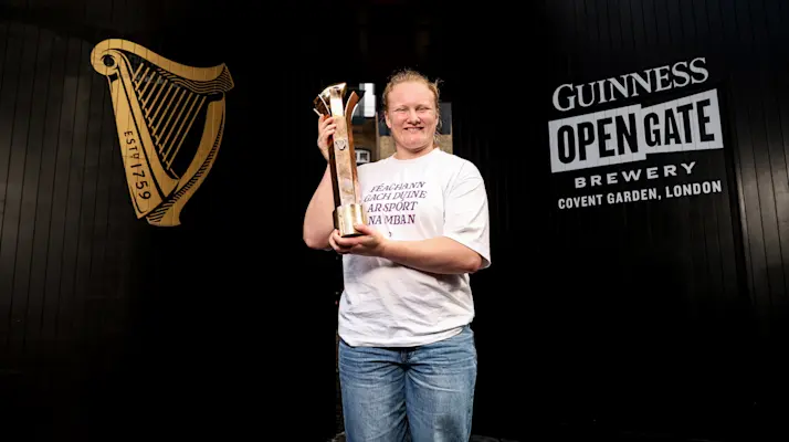 Aoife Wafer holding the 2026 Guinness Player of the Championship award at the Guinness Open Gate Brewery.