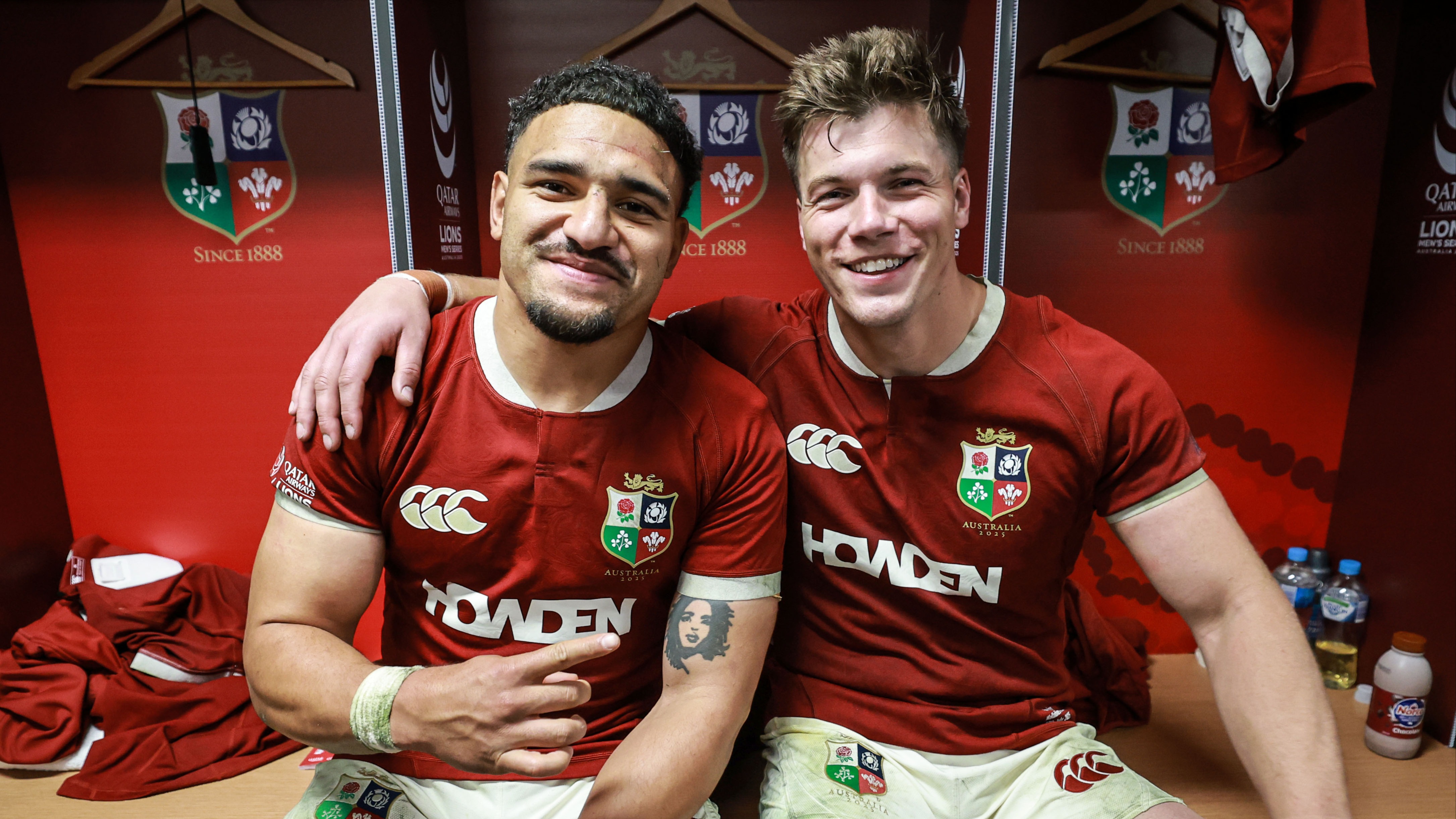 Sione Tuipulotu and Huw Jones following victory in the first Lions Test, 2025