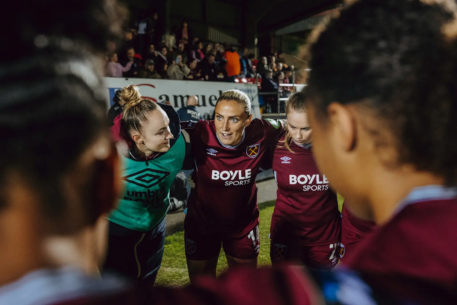 Women's team huddle Brighton