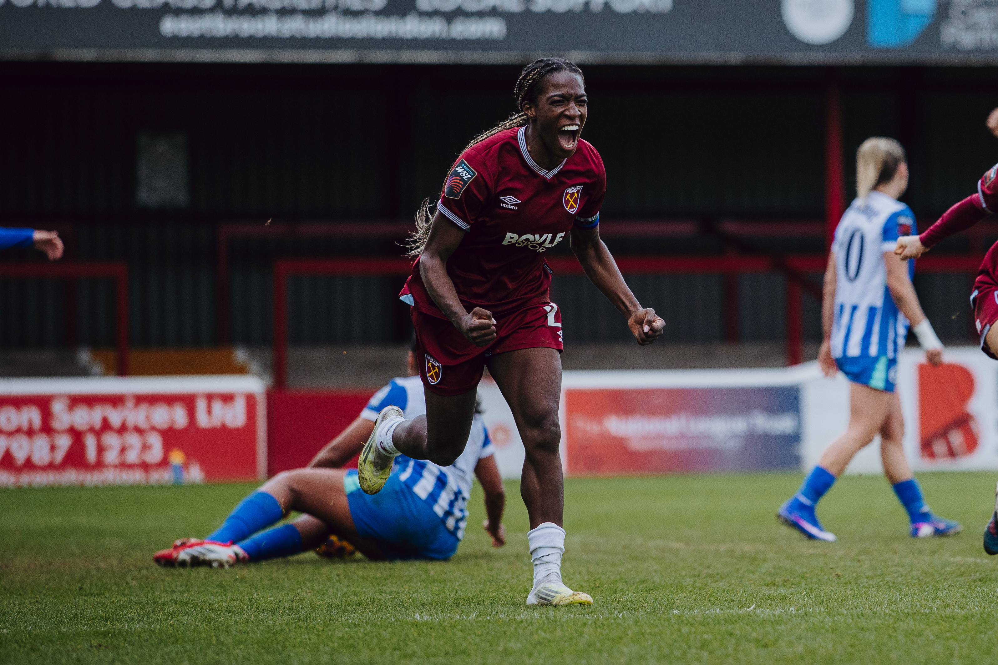 Viviane Asseyi celebrates late winner v Brighton & Hove Albion
